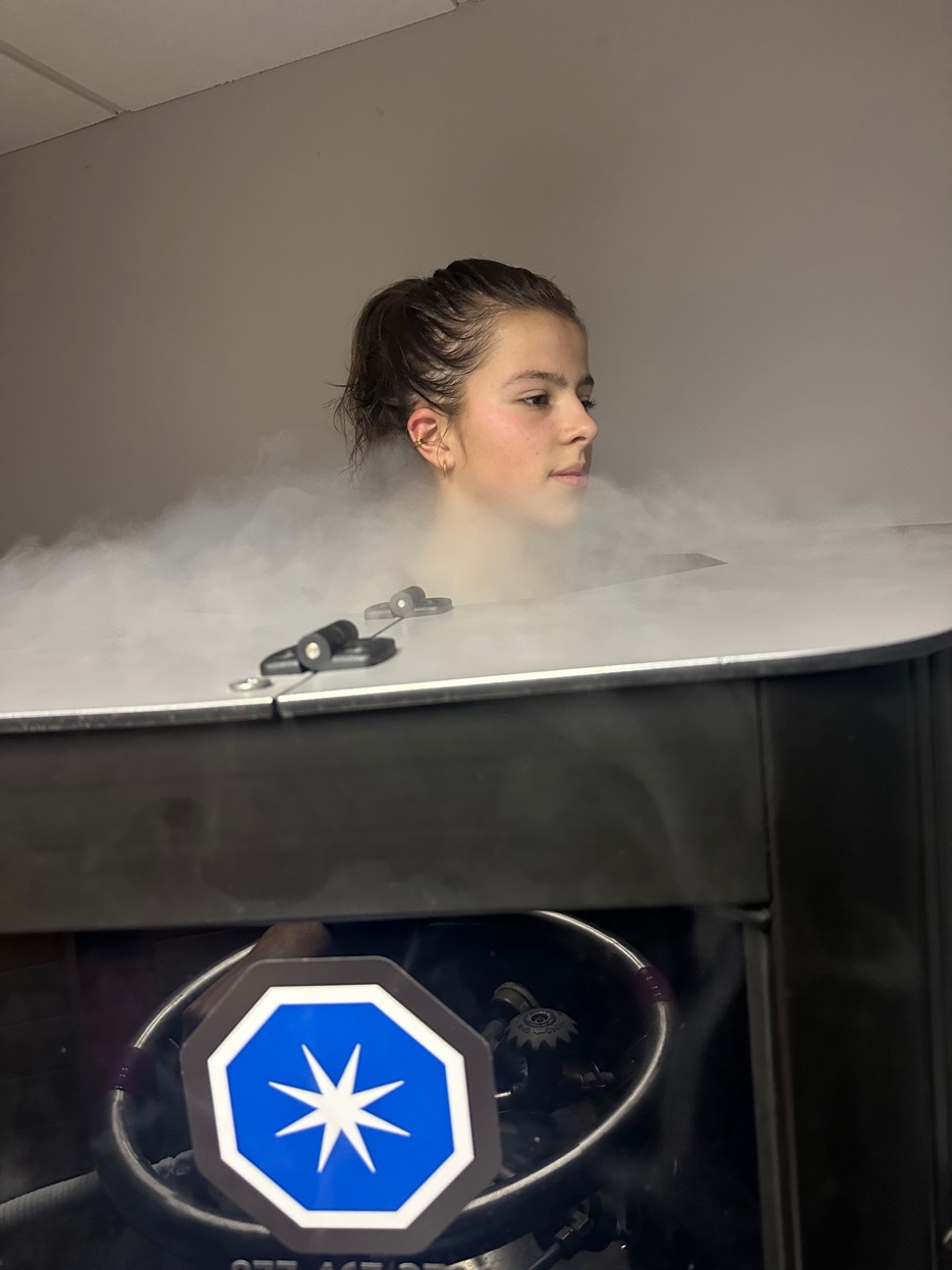 Client in cryotherapy chamber profile