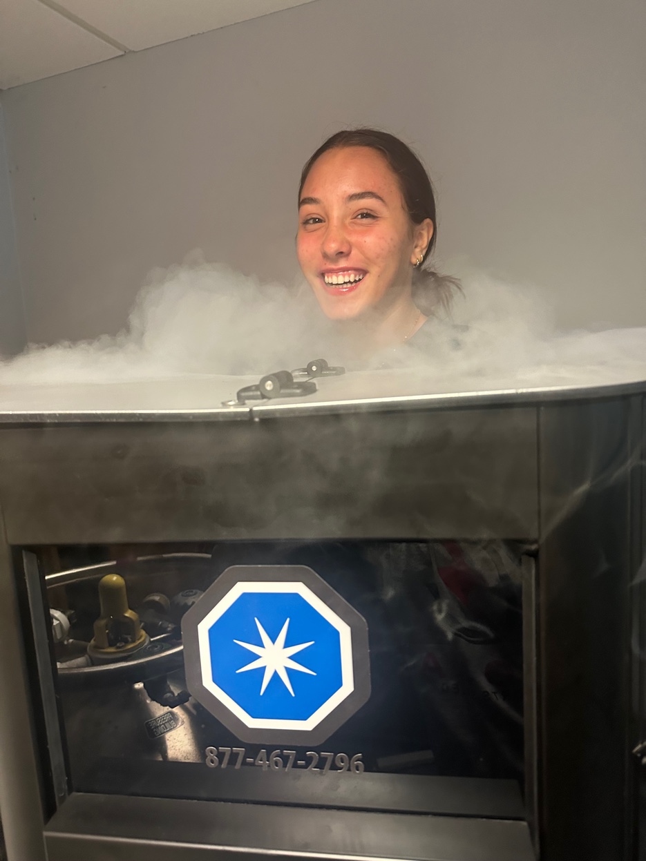 Client smiling in cryo chamber