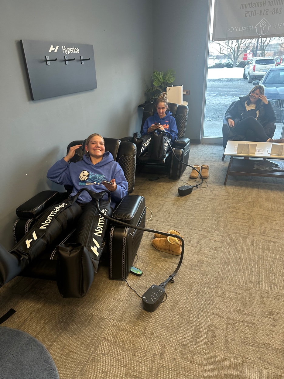 Athletes in Normatec compression therapy