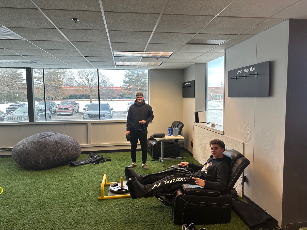 Athletes in Normatec recovery boots