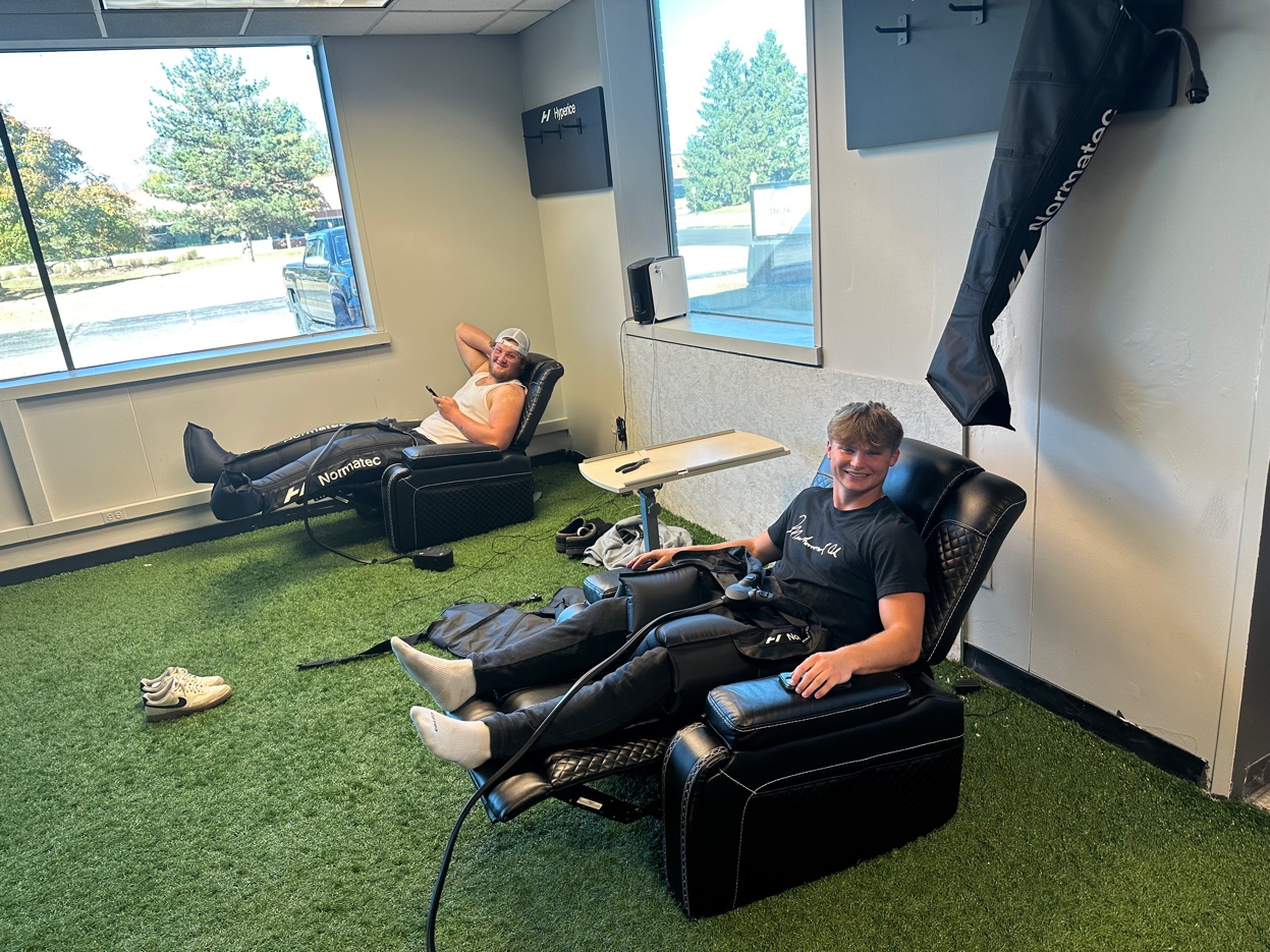 Athletes recovering with Normatec compression